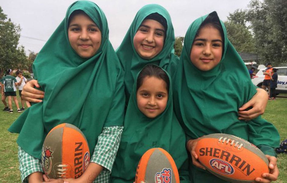 SLIDER-ManyCulturesOneGame.jpg These children from Afghanistan have embraced the chance to learn Australian Rules Football. Credit: ABC Riverina / Verity Gorman - AFL,GWS Giants